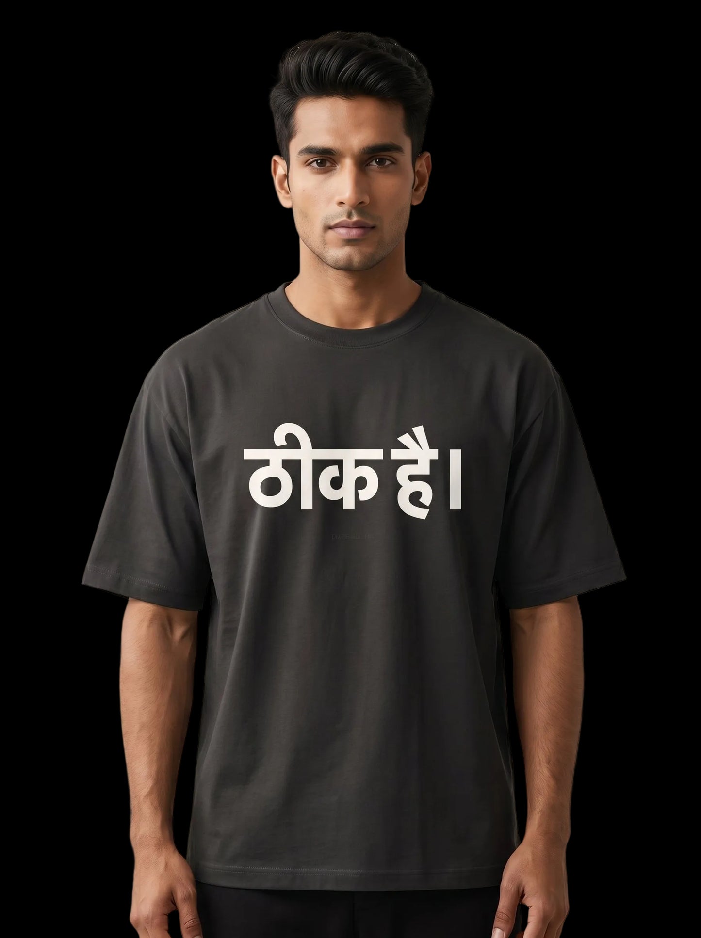 Man wearing a black t-shirt with white text on a neutral background